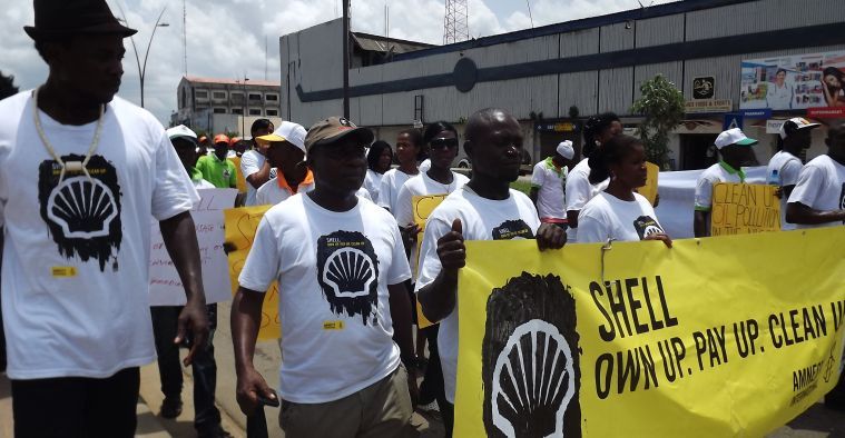 In Port Harcourt, Nigeria, activists, partner organizations and Amnesty International call on Shell to own up, pay up and clean up the Niger Delta, as part of a week of action in April 2012.